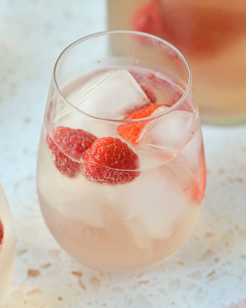 Rose Sangria with Berries - close up of glass