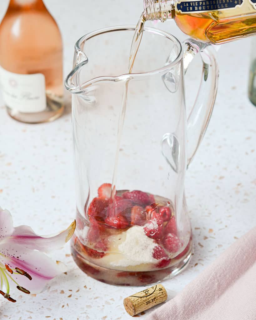 Rose Sangria with Berries - pouring St. Germain