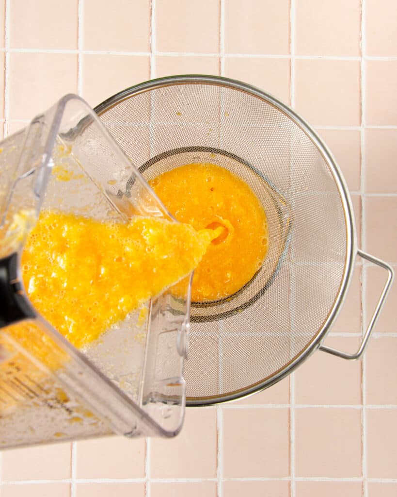 straining homemade mandarin juice
