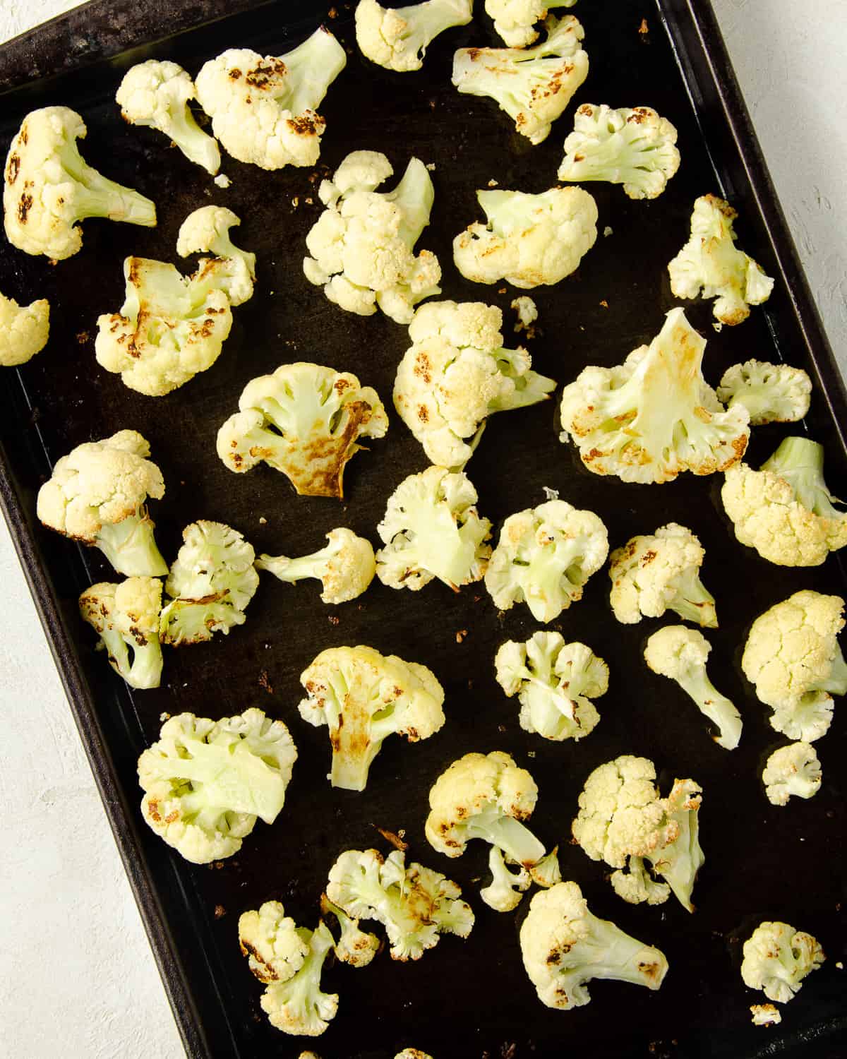 Cauliflower florets browned after roasting.
