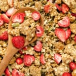 Featured image of protein granola on a brown wooden spoon.