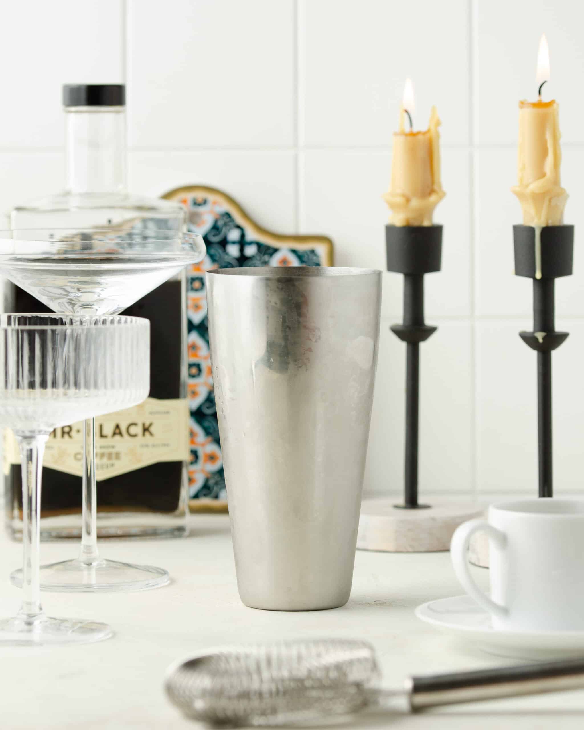 Espresso martini in a cocktail shaker on the kitchen counter.