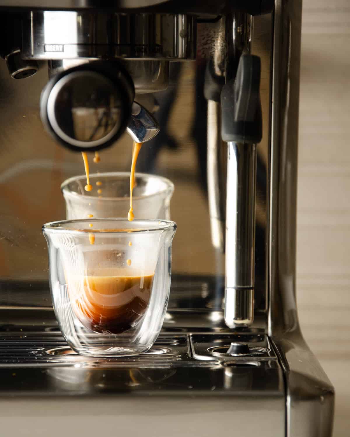 Brewing a shot of espresso with an espresso machine.
