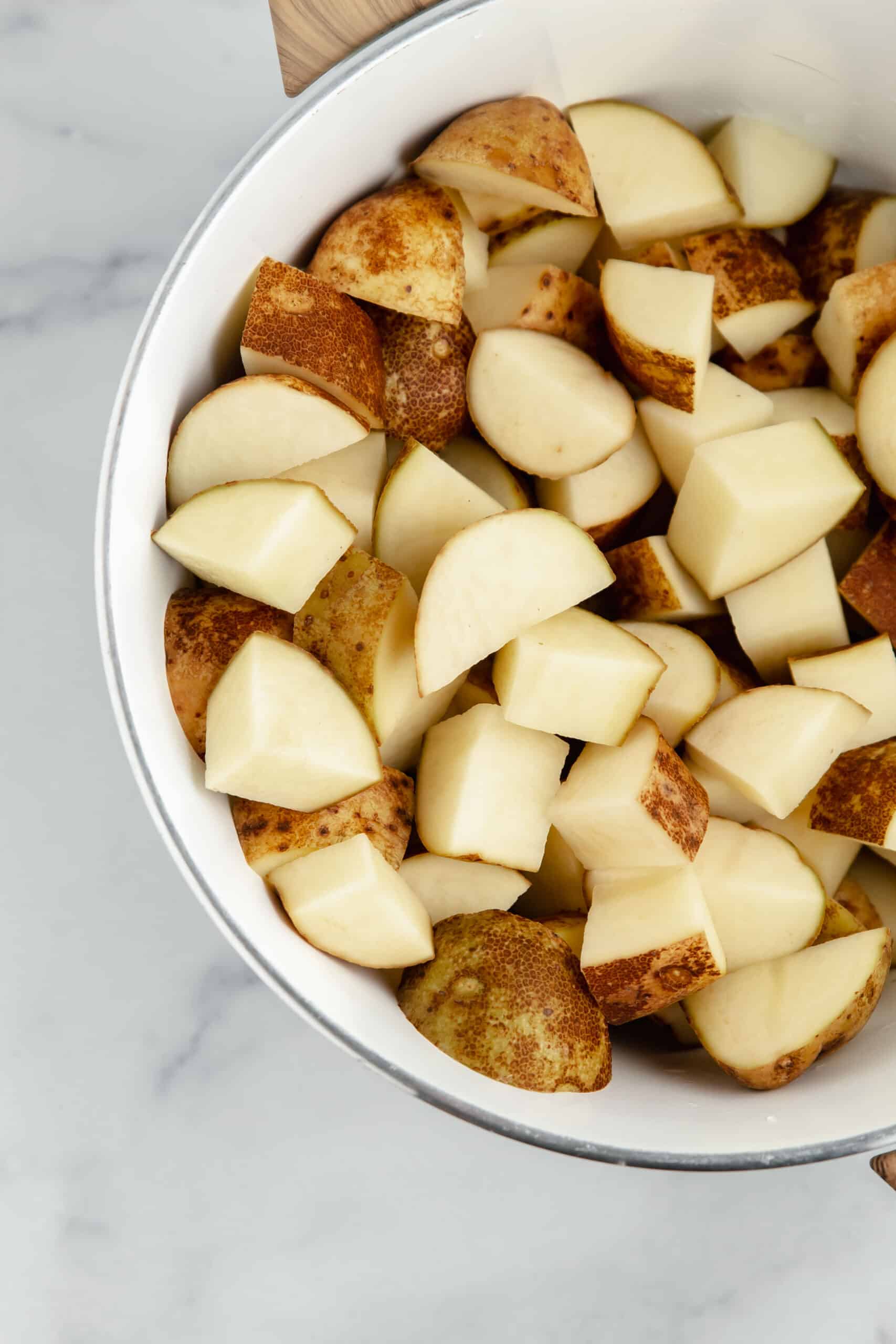 A bowl of diced potatoes.