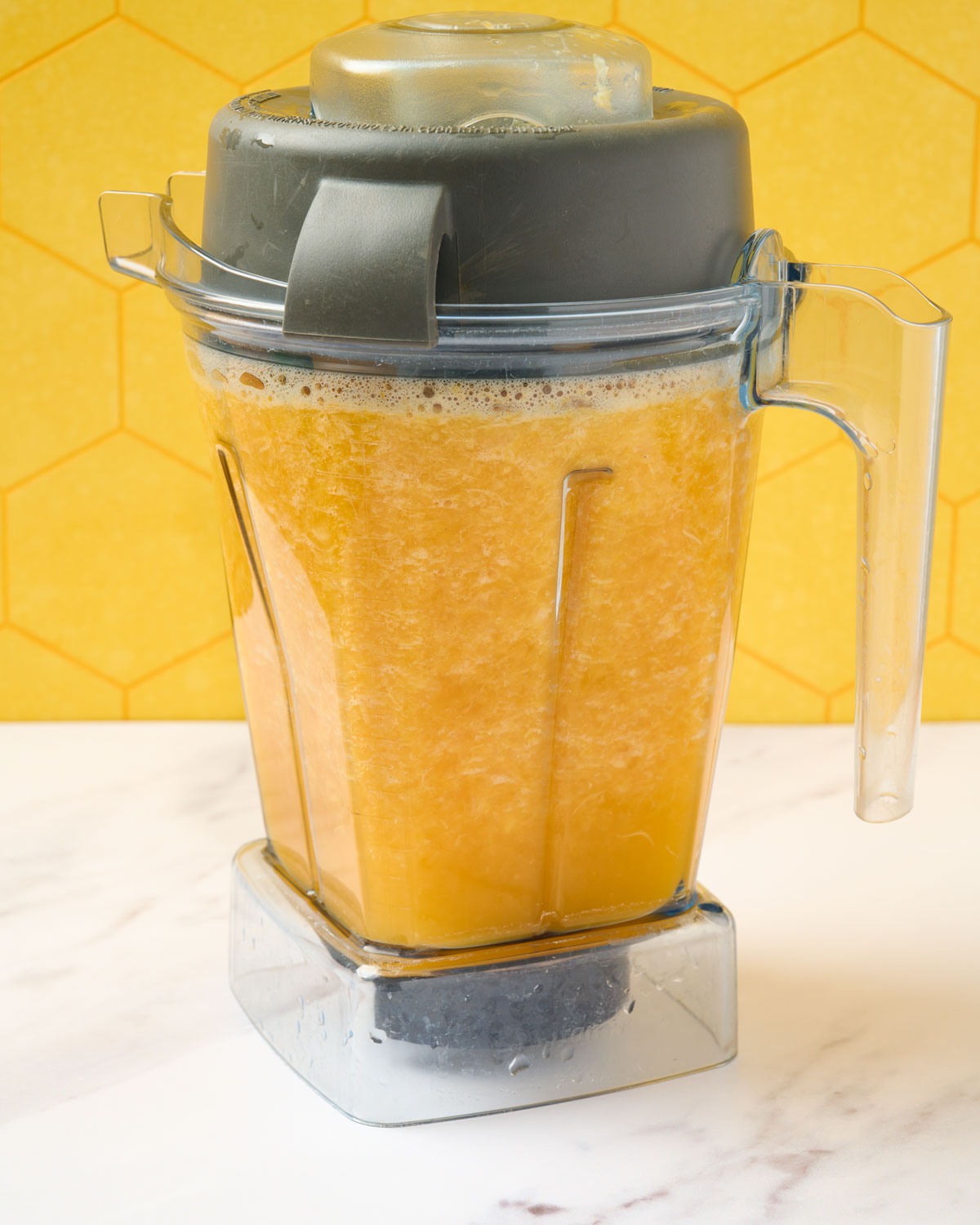 Mandarin juice blended in the blender prior to straining.