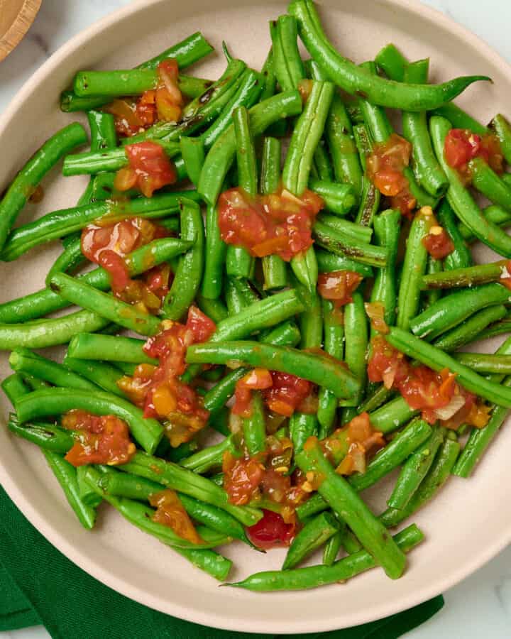 Mexican green beans with salsa in a serving plate.