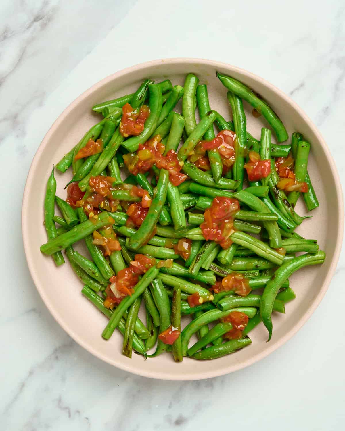 Mexican green beans topped with salsa.