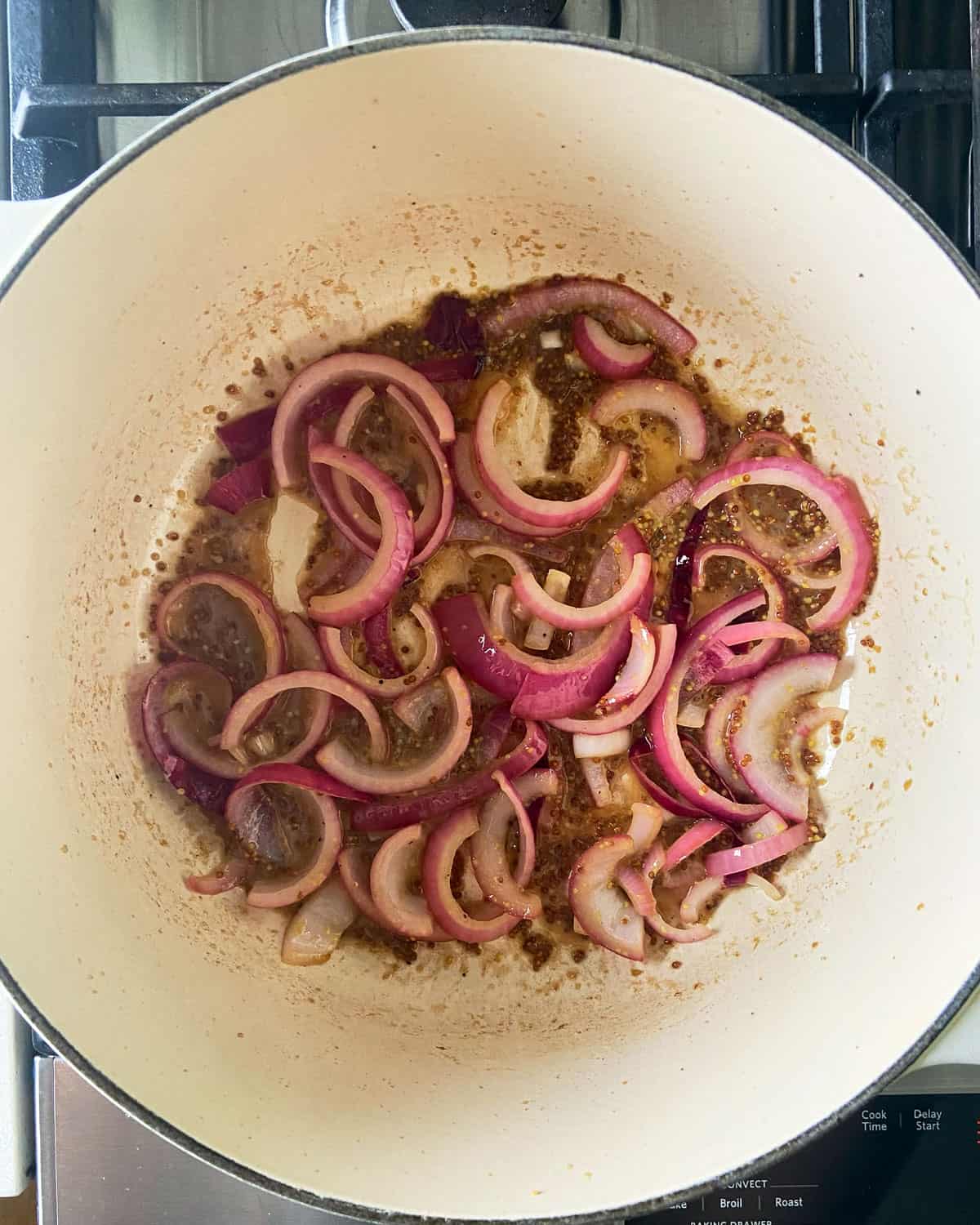 Onions and pan sauce in a dutch oven.