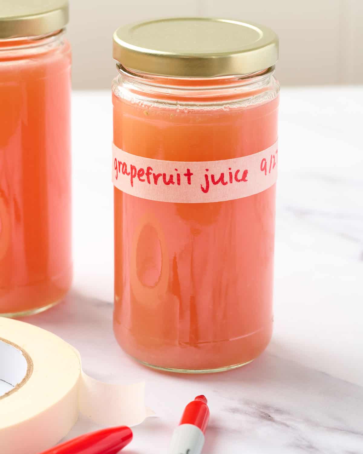 Grapefruit juice in a container with a label.