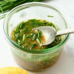 Lemon and chive dressing in a small bowl.