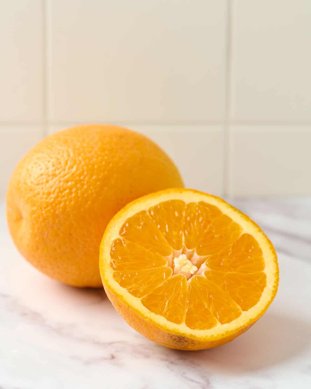 valencia oranges on marble